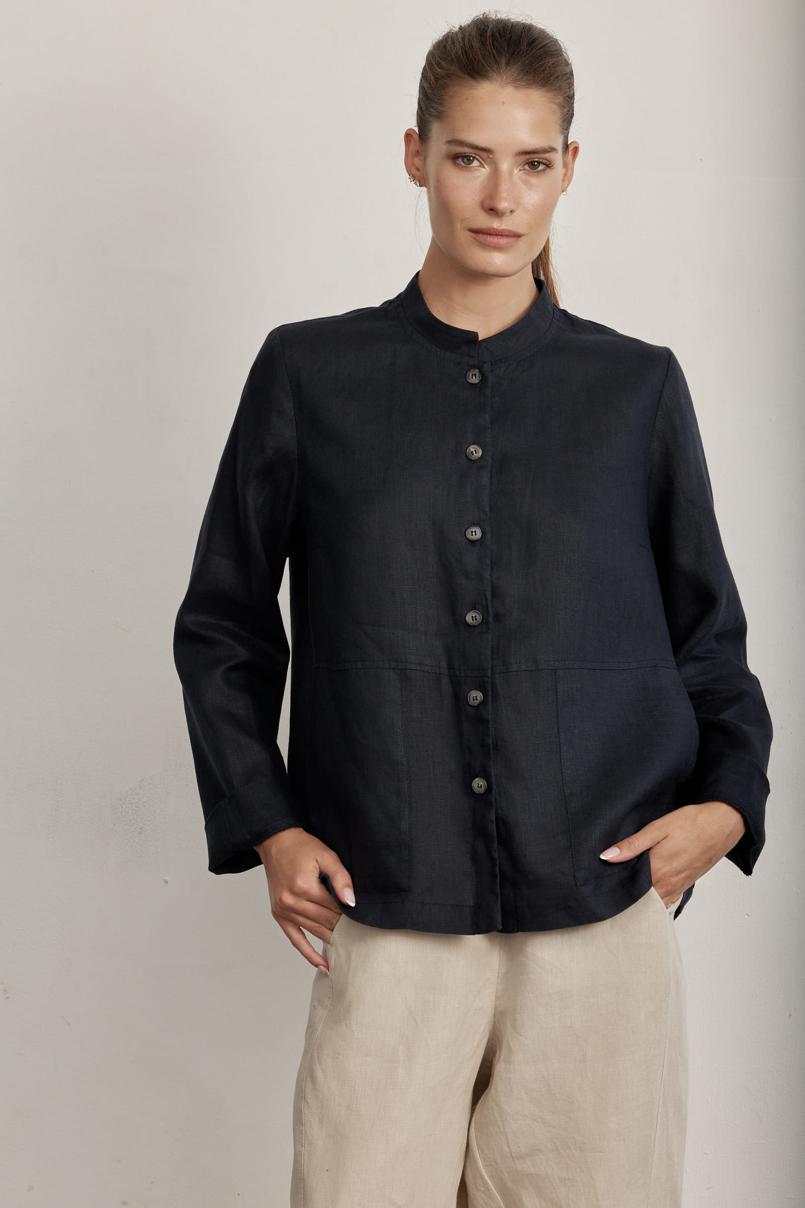 Black button-front long-sleeve shirt with stiff collar